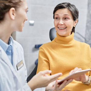 a woman speaking with her dentist