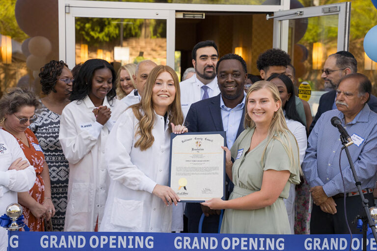 Dr Moss and team at the grand opening
