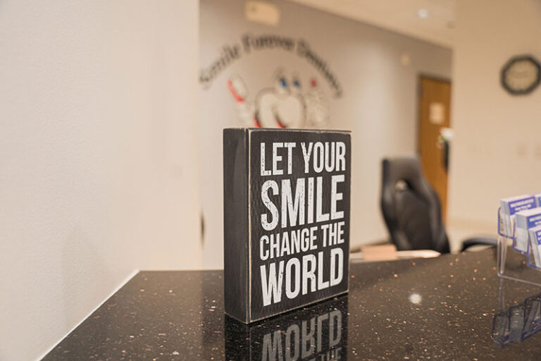 Let your smile change the world desk sign