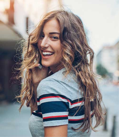 a young woman looking back at the camera